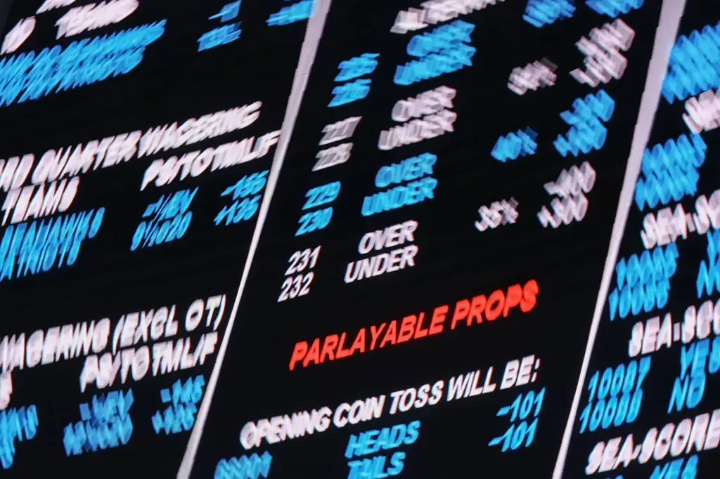 A sportsbook digital display showing wagering odds, over/under lines, and parlayable prop bets for an NFL game